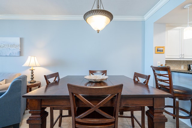 dining space featuring ornamental molding