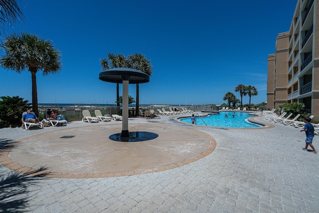 view of swimming pool with a patio area