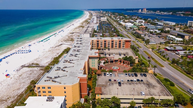 aerial view featuring a water view and a beach view