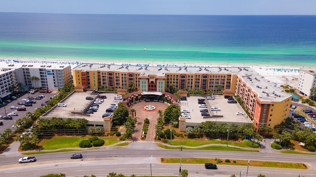 birds eye view of property featuring a view of the beach and a water view