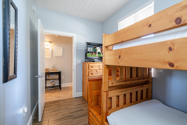 bedroom with hardwood / wood-style floors