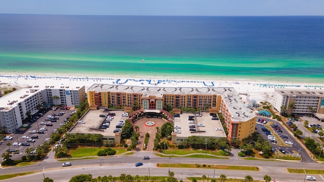 birds eye view of property with a view of the beach and a water view