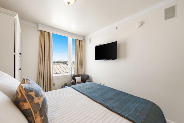 bedroom with ornamental molding