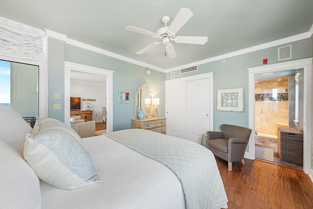 bedroom featuring ceiling fan, a closet, hardwood / wood-style floors, and ornamental molding