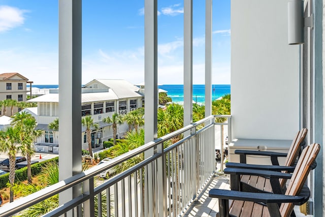 balcony featuring a water view