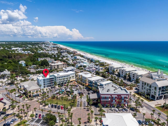 birds eye view of property with a view of the beach and a water view