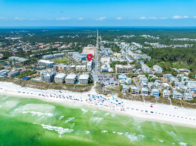 birds eye view of property with a view of the beach and a water view