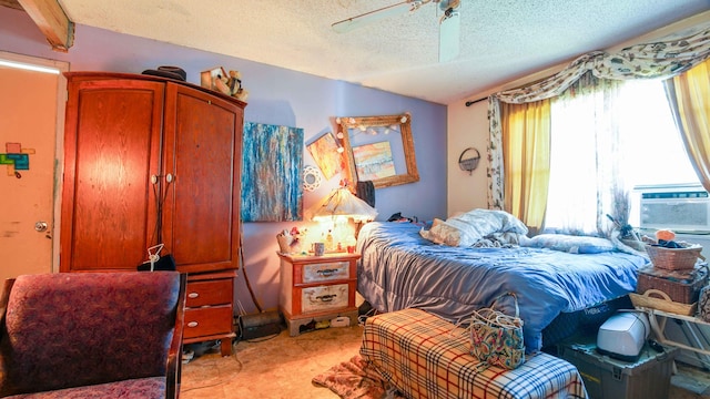 bedroom featuring beam ceiling, a textured ceiling, and ceiling fan