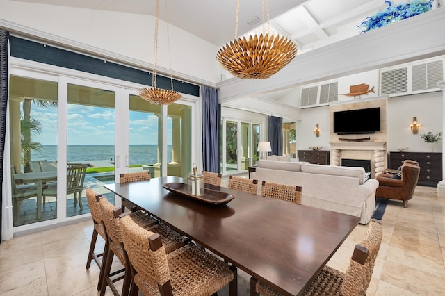 dining room featuring a water view, coffered ceiling, a notable chandelier, high vaulted ceiling, and light tile floors