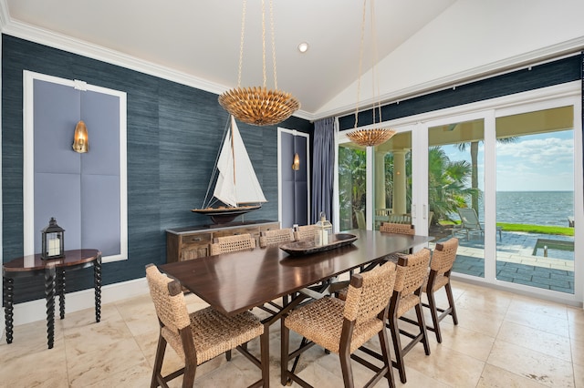 dining room featuring a water view, light tile floors, and lofted ceiling