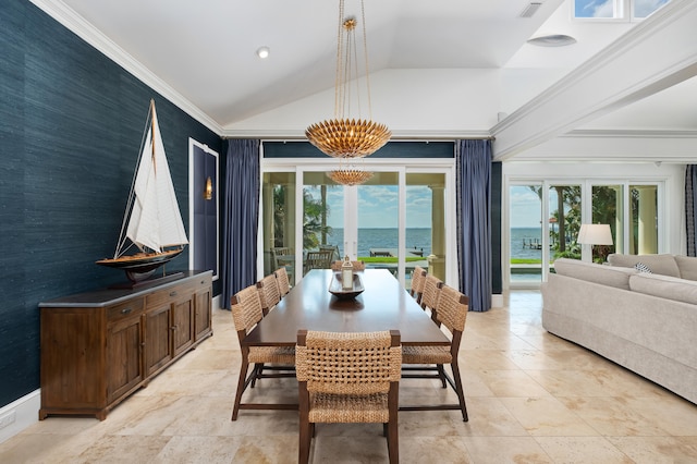 tiled dining room with a healthy amount of sunlight, a notable chandelier, a water view, and lofted ceiling