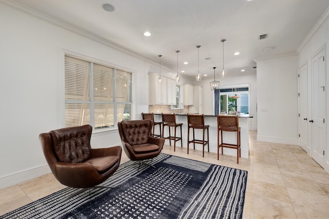 living room with ornamental molding and light tile floors