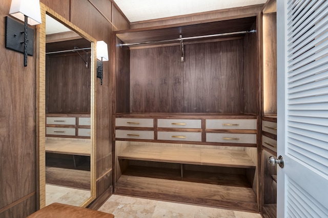 walk in closet featuring light tile flooring