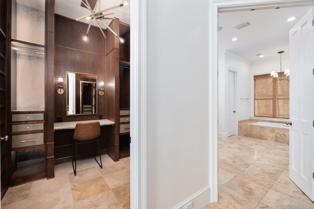 interior space featuring a notable chandelier and light tile flooring