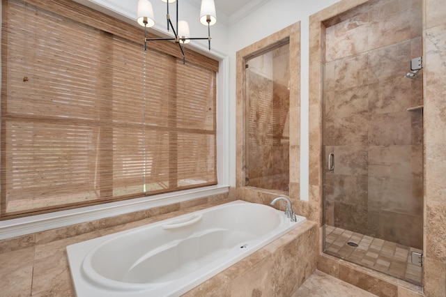 bathroom with shower with separate bathtub, a notable chandelier, ornamental molding, and tile floors