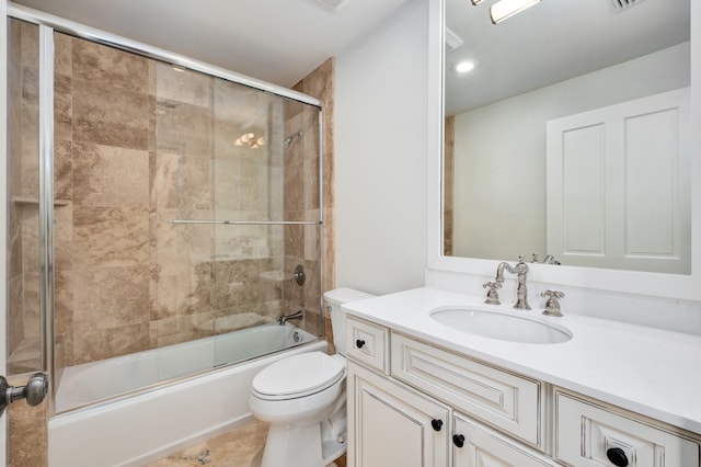 full bathroom with combined bath / shower with glass door, toilet, tile floors, and large vanity