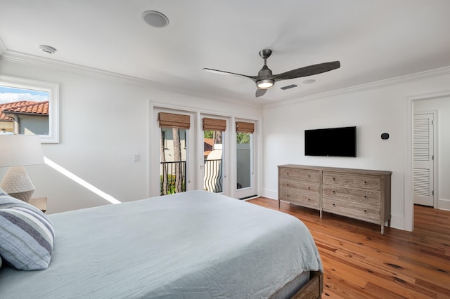 bedroom with ceiling fan, access to exterior, crown molding, and hardwood / wood-style flooring