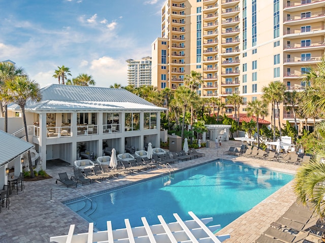 view of swimming pool featuring a patio