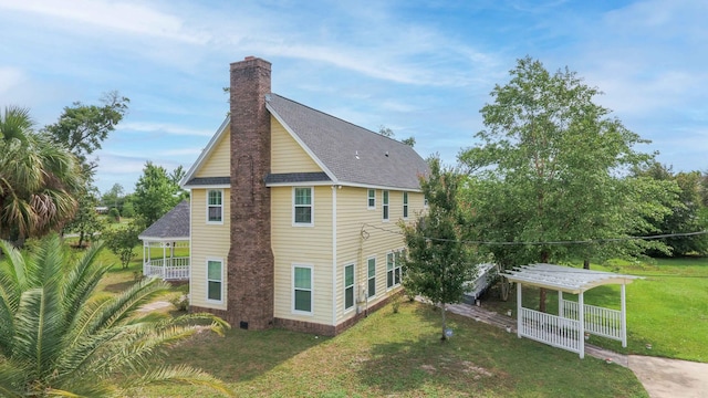 back of house with a yard