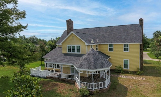 rear view of house with a lawn