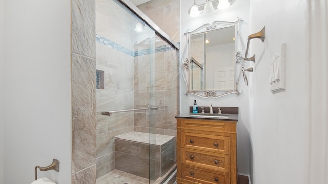 bathroom featuring vanity with extensive cabinet space and an enclosed shower