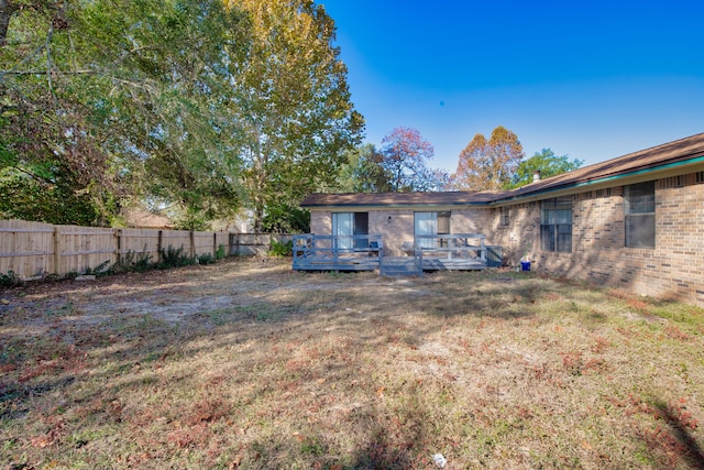 view of yard featuring a wooden deck