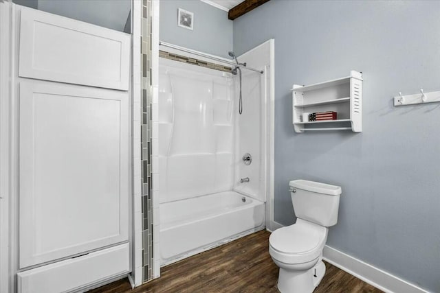 bathroom with hardwood / wood-style floors, toilet, and shower / washtub combination