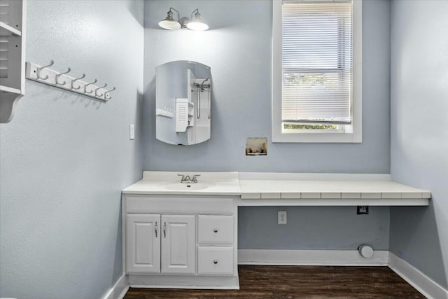 bathroom featuring vanity and wood-type flooring