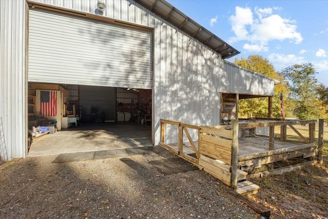 view of property exterior with an outbuilding