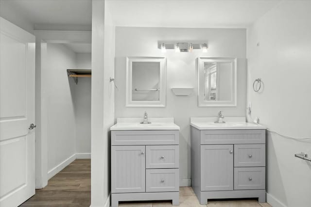 bathroom with vanity and wood-type flooring