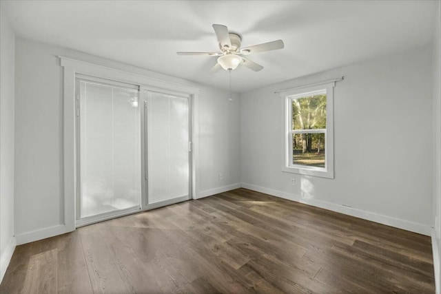 unfurnished bedroom with dark hardwood / wood-style flooring and ceiling fan