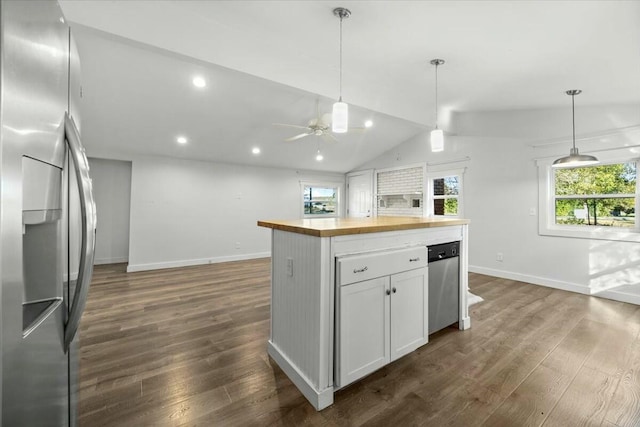 kitchen with vaulted ceiling, stainless steel fridge with ice dispenser, butcher block countertops, dark hardwood / wood-style flooring, and white cabinetry