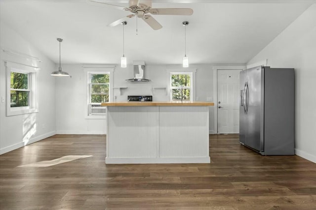 kitchen with stainless steel refrigerator with ice dispenser, lofted ceiling, dark hardwood / wood-style floors, and wall chimney exhaust hood