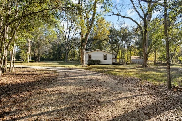 view of yard with a wooden deck