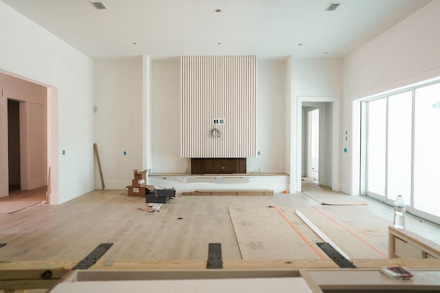 unfurnished living room with plenty of natural light