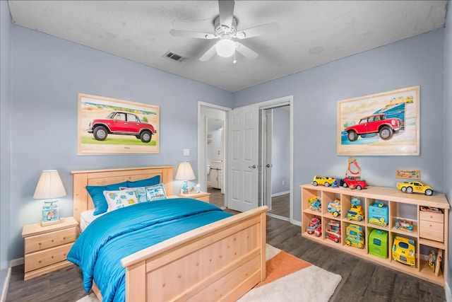 bedroom featuring ceiling fan and dark wood-type flooring