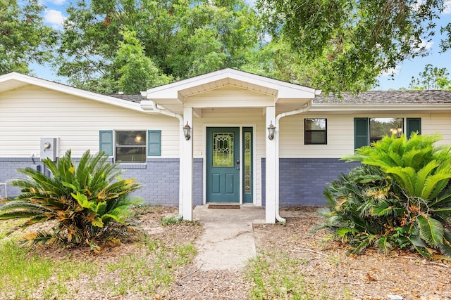 ranch-style home with covered porch