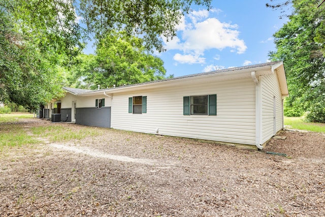 back of property with central air condition unit