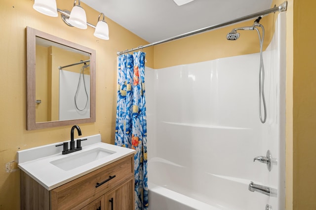 bathroom featuring shower / bath combo and vanity