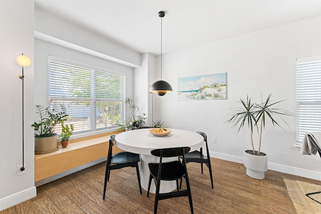 dining space featuring dark hardwood / wood-style floors