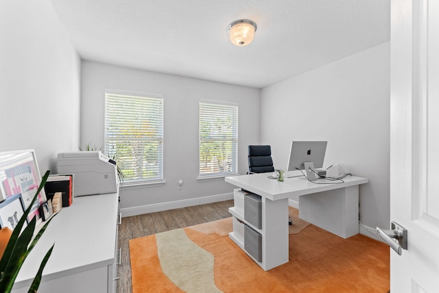 office area with light hardwood / wood-style floors