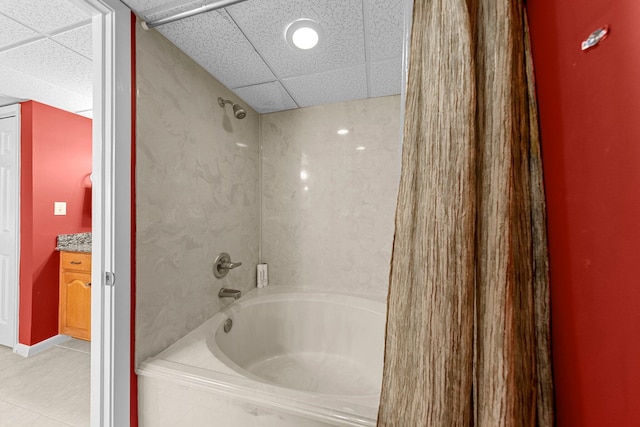 bathroom featuring tile floors, shower / tub combination, vanity, and a drop ceiling