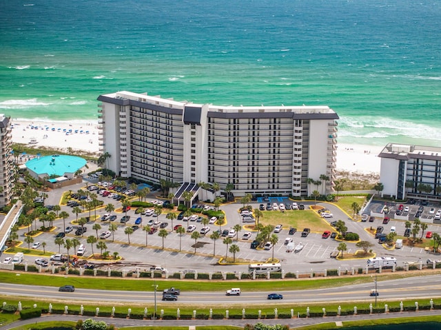 birds eye view of property featuring a view of the beach and a water view