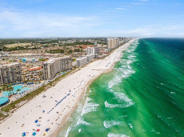 birds eye view of property featuring a water view and a view of the beach