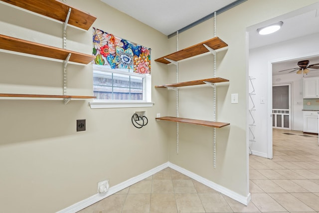 washroom with washer hookup, ceiling fan, light tile flooring, and hookup for an electric dryer