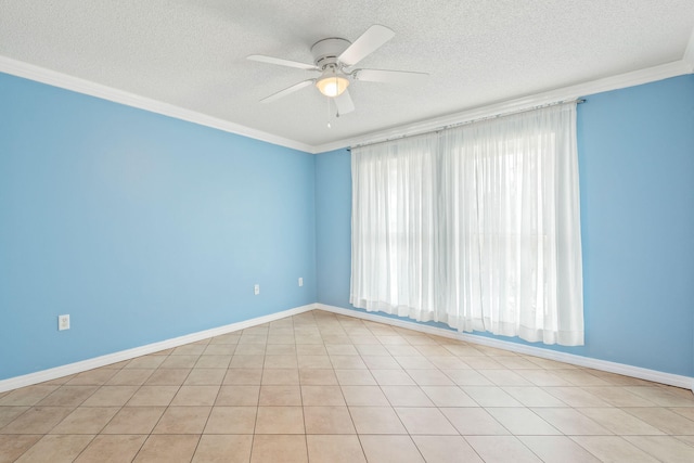 tiled spare room featuring a textured ceiling, ceiling fan, crown molding, and a wealth of natural light