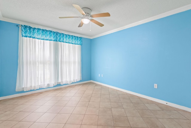 tiled spare room featuring a textured ceiling, ceiling fan, and crown molding