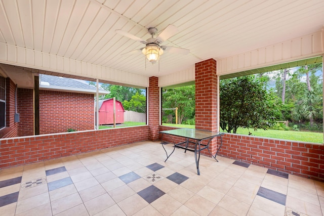 view of terrace featuring a storage unit and ceiling fan