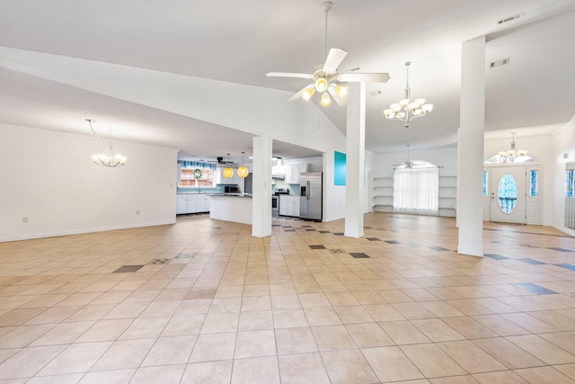 unfurnished living room with ornamental molding, light tile flooring, and ceiling fan with notable chandelier