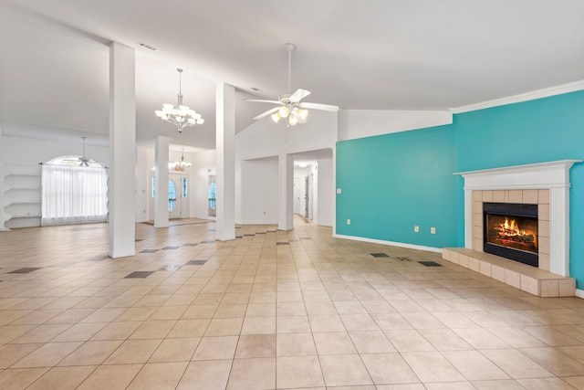 unfurnished living room featuring ceiling fan with notable chandelier, a tile fireplace, light tile floors, high vaulted ceiling, and ornamental molding